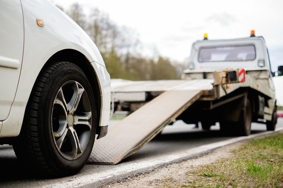 white car being towed